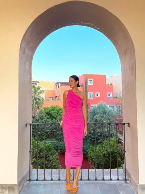 the miller affect wearing the pink norma kamali diana gown